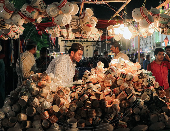 A man selling cups near Charminar