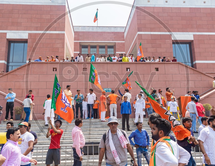Supporters holding flags to support Bhartiya Janta Party(BJP) at th BJP Head Office, Delhi