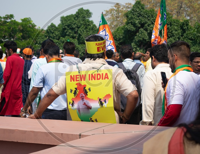 A man having a banner to support Bhartiya Janta Party(BJP)