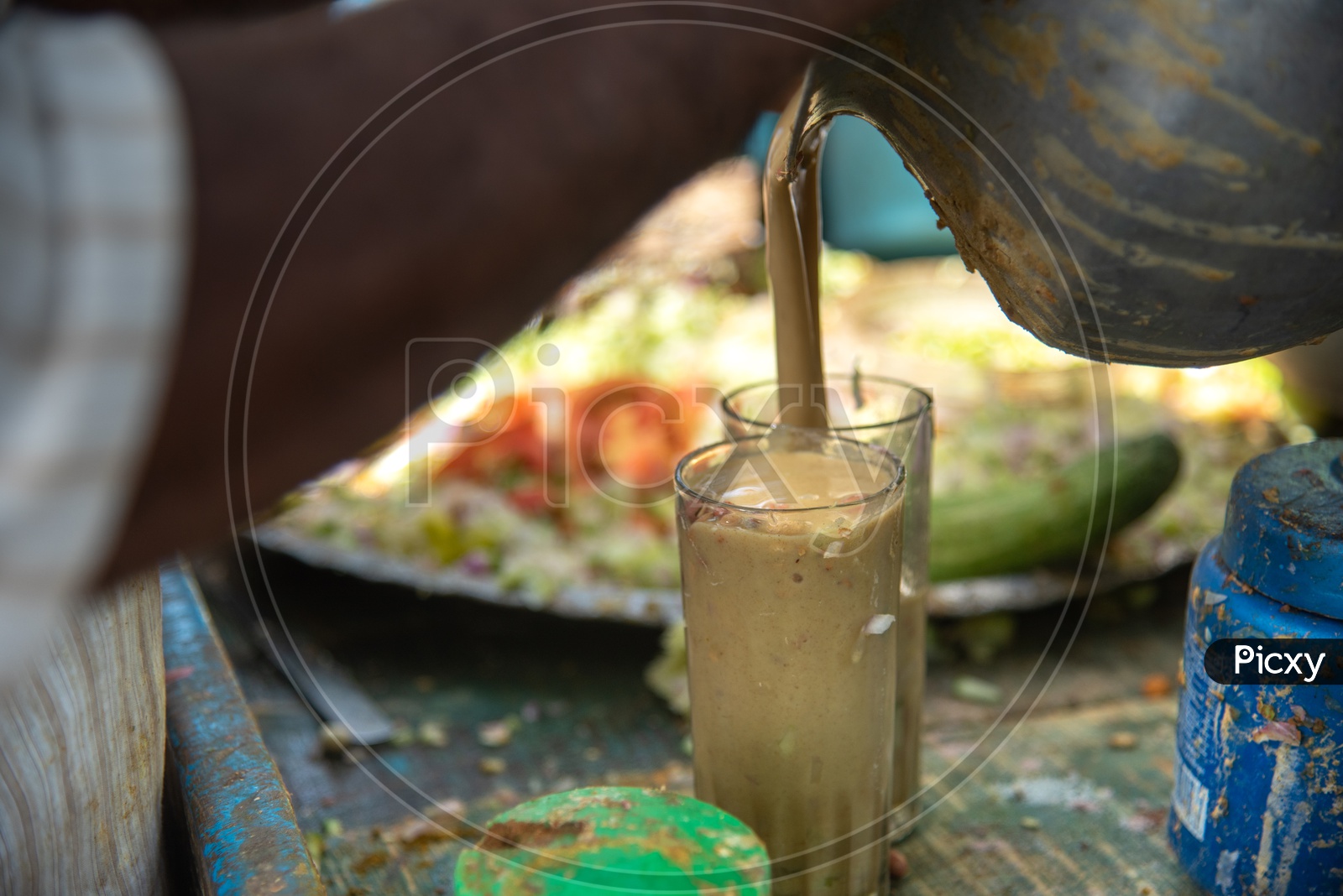 A  Street Vendor Preparing Sattu Drink  Or  Sattu Sharbat  Drink Or  Sattu Maavu  Drink  At a Roadside Stall