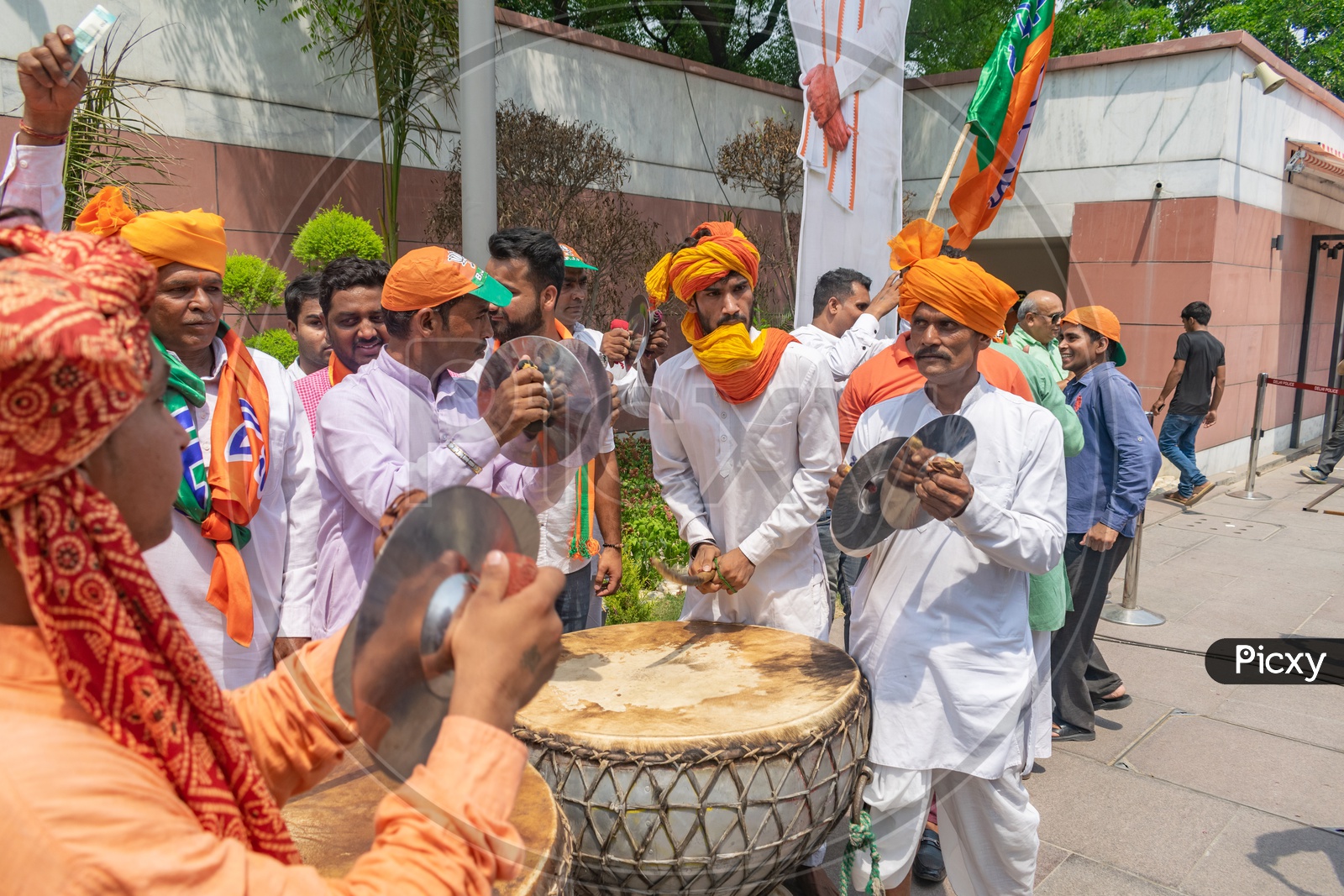 Men playing cymbals (Jhanj-manjira) and drums(Nagada) at the occasion of Bhartiya Janta Party(BJP) victory