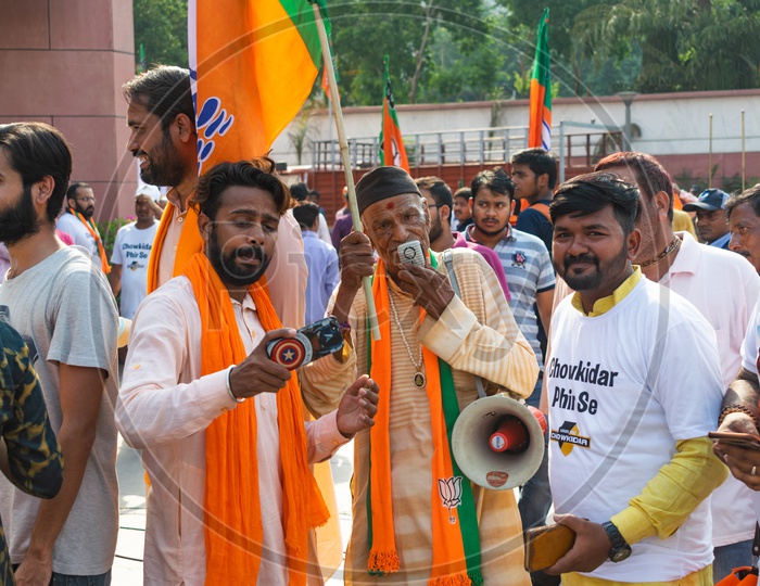 A man speaking in megaphone to support Bhartiya Janta Party (BJP)