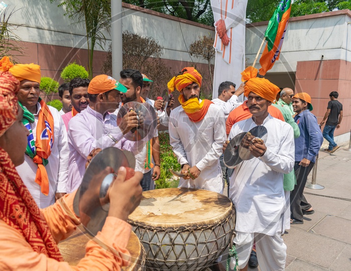 Men playing cymbals (Jhanj-manjira) and drums(Nagada) at the occasion of Bhartiya Janta Party(BJP) victory