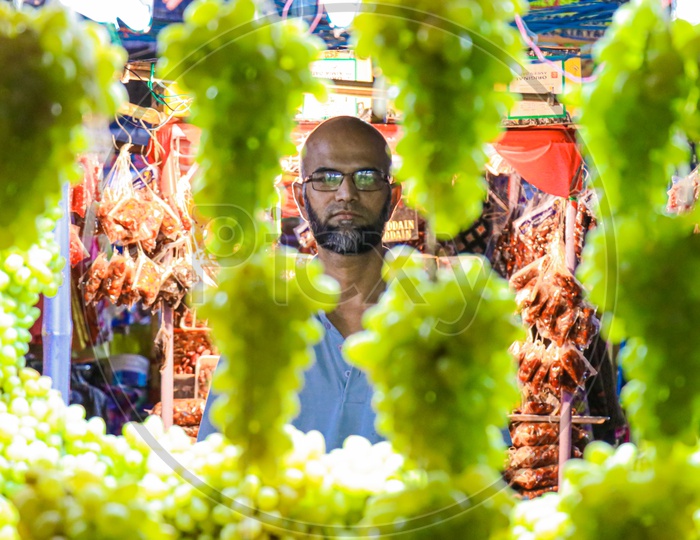 Fruit vendor selling grapes
