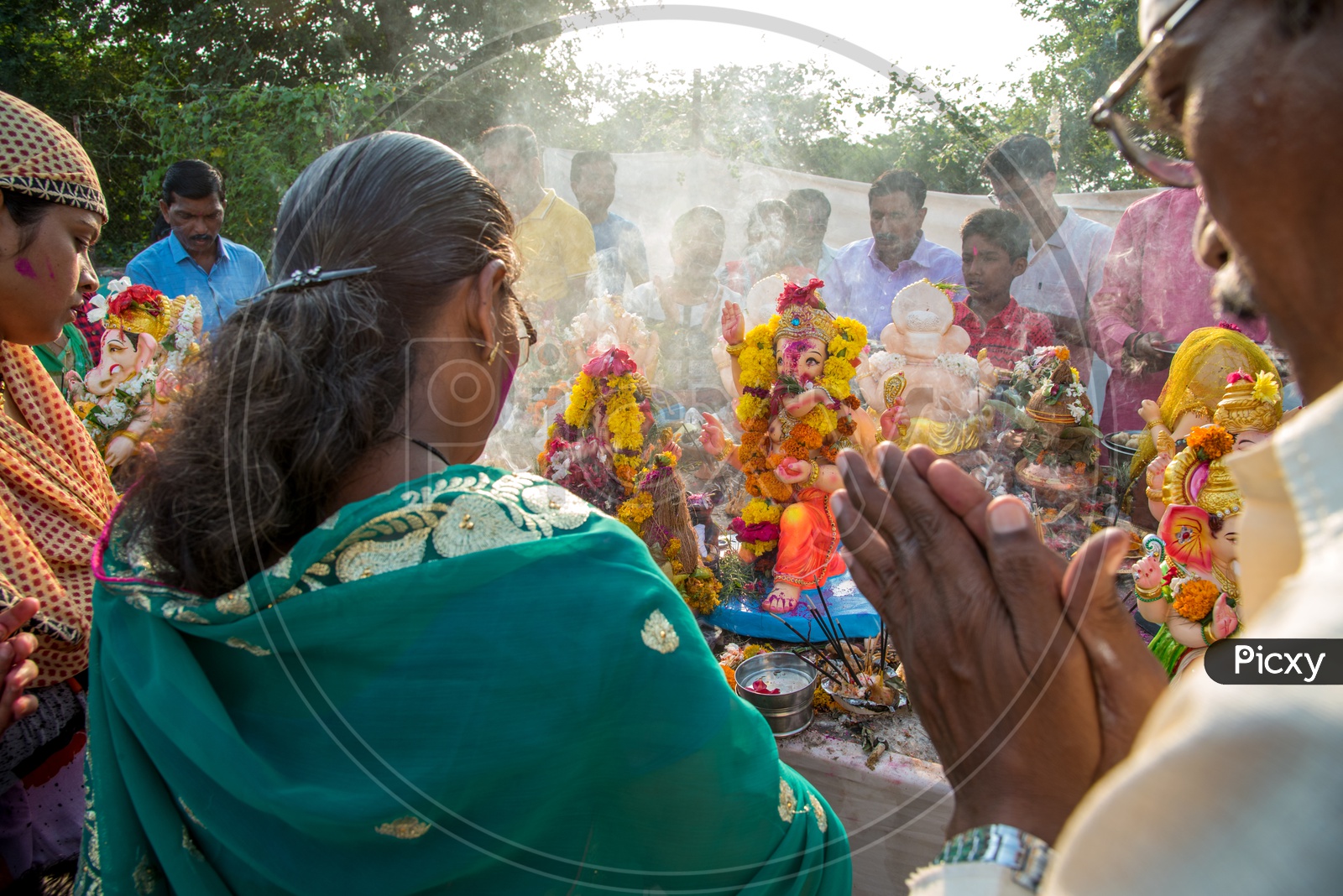 Indian Hindu Devotees Worshiping lord  Ganesh Idols  For The Last Time Before Visarjan Or Nimarjan  During The Ganesh Chathurdi Or Vinayaka Chaviti Festival