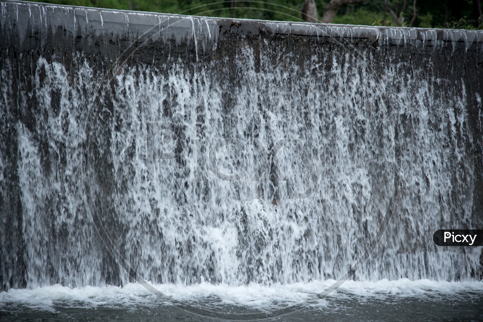 River Water Flowing Down from Check Dam Walls