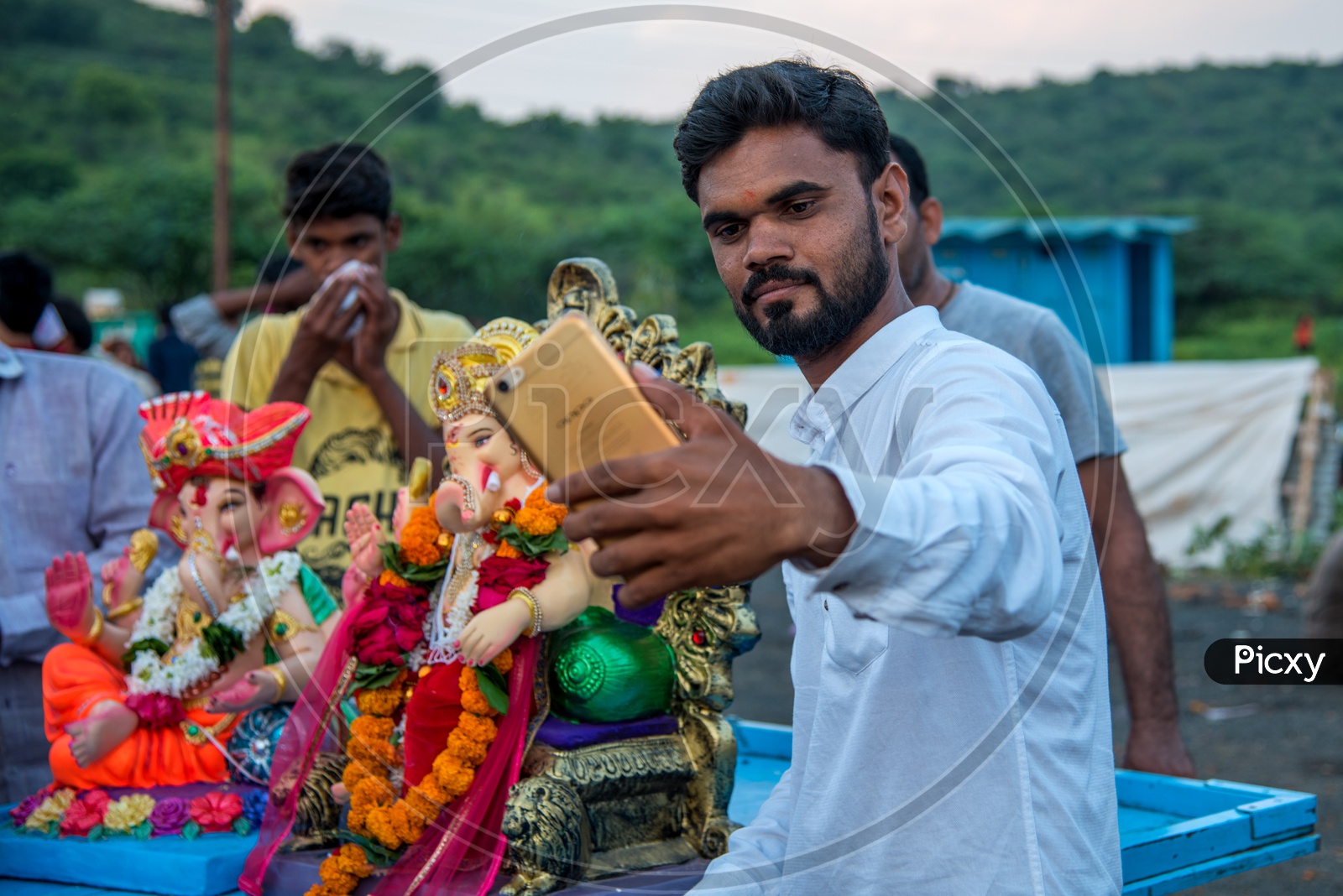 An Indian Young Man Taking A Selfie In Smart Phone With Ganesh Idol During  Ganesh Visarjan Or  Nimarjan