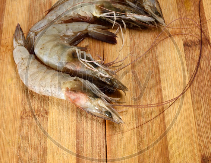 Fresh Prawn Or Shrimp  Placed On an Isolated  Wooden Table Background
