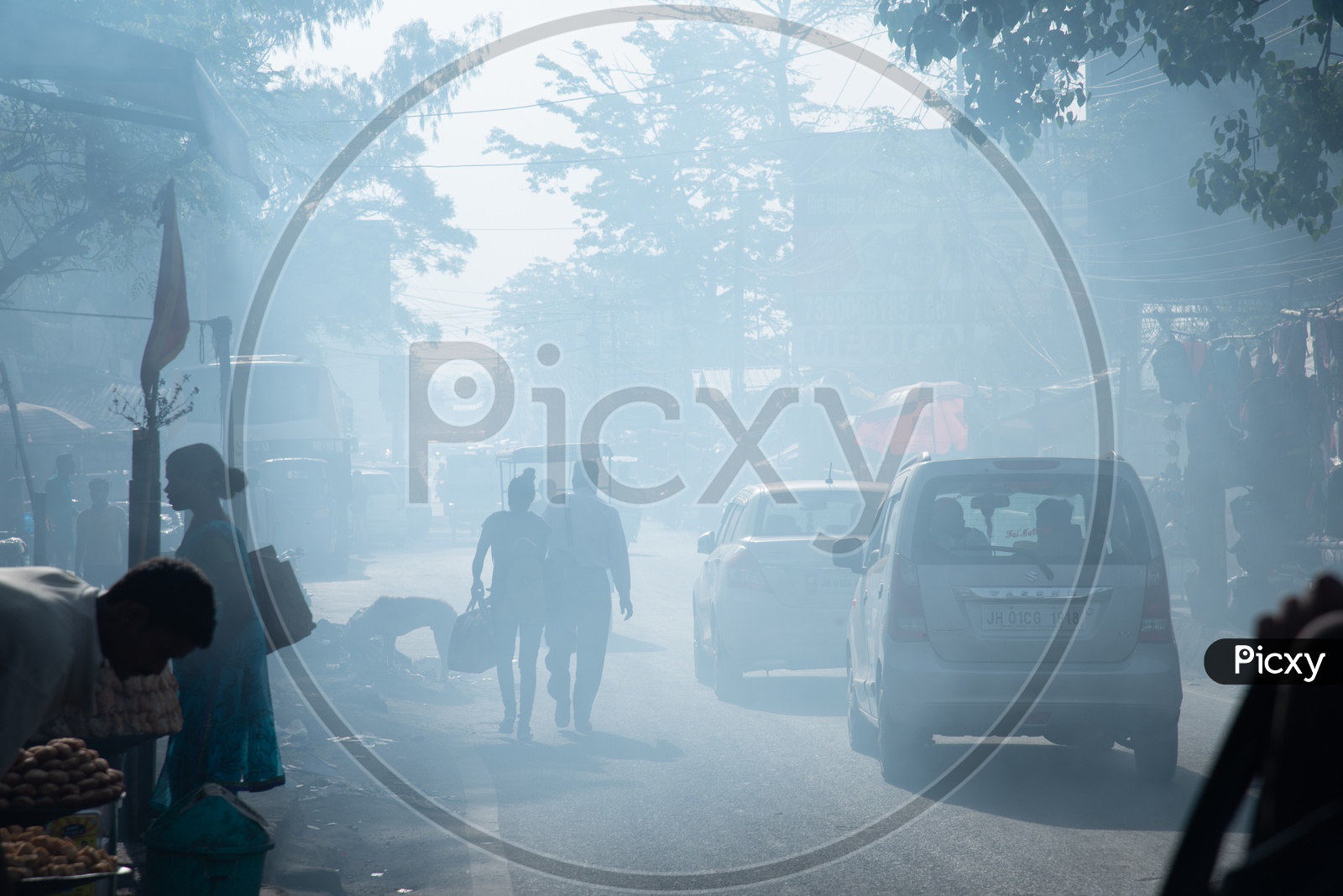 Pedestrians  Walking On The Smoke Filled Roads   in Indian Cities