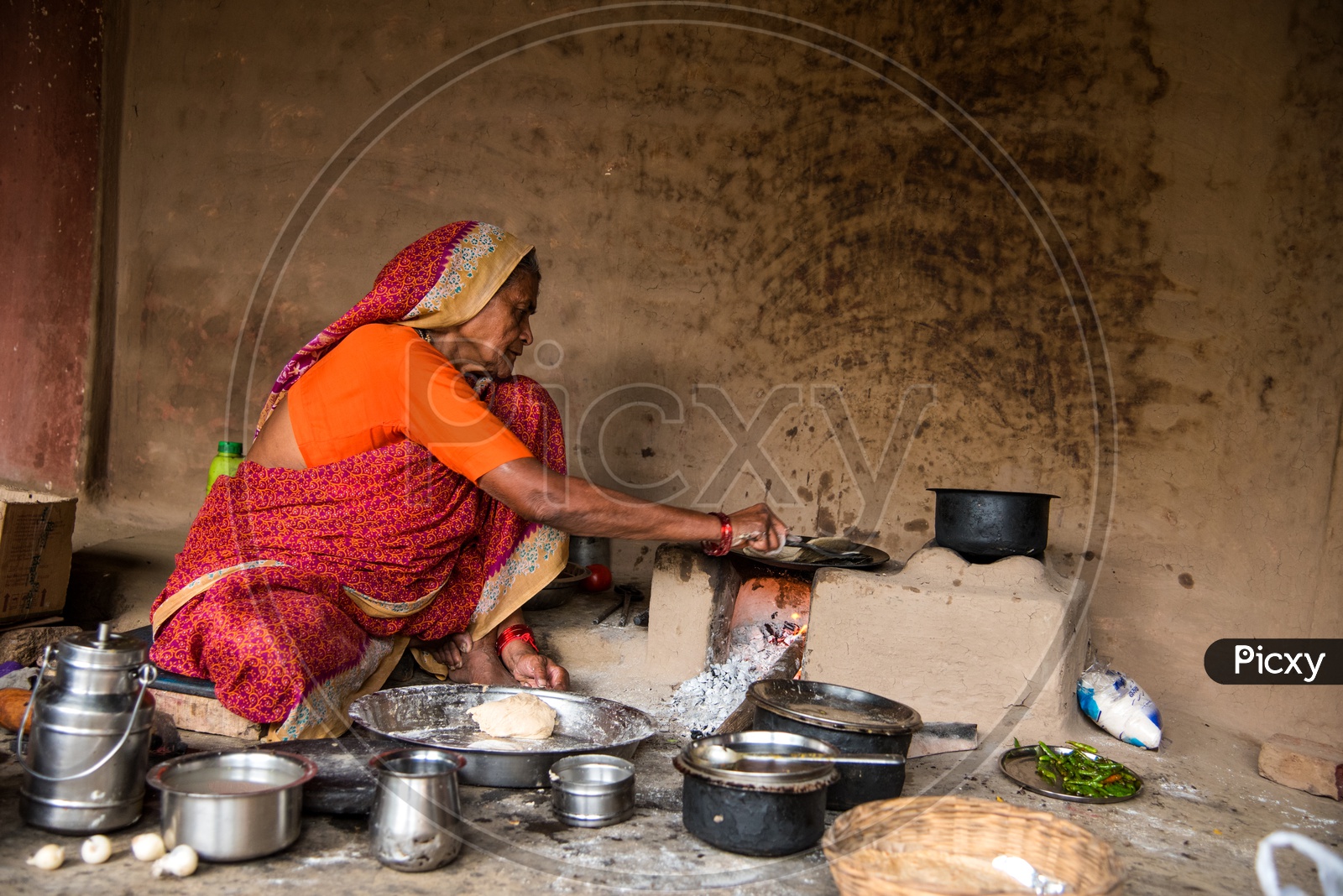 Image of An Indian Old Woman Making Or Cooking Food In an Ancient Or ...