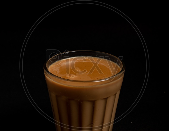 Aromatic beverage Tea/chai   placed  on a black background.