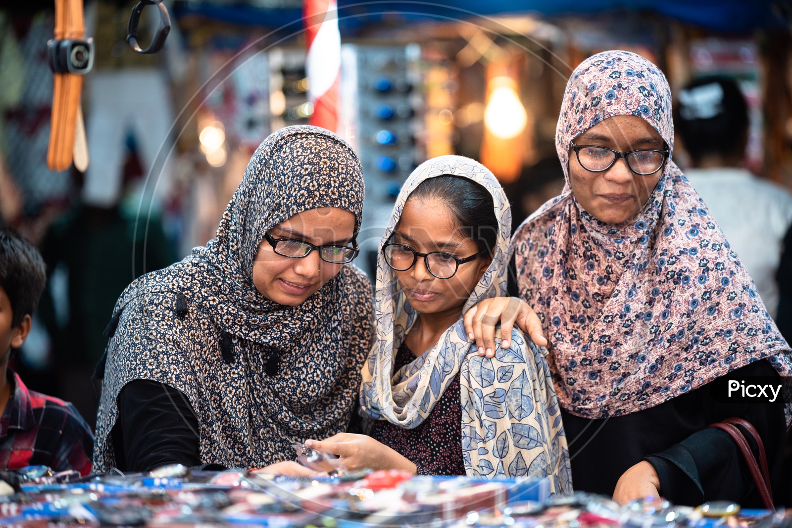Muslim Women In Bhurkha   Shopping  Wrist Watches  in a  street stall Around Charminar  During  Ramadan or Ramzan Season