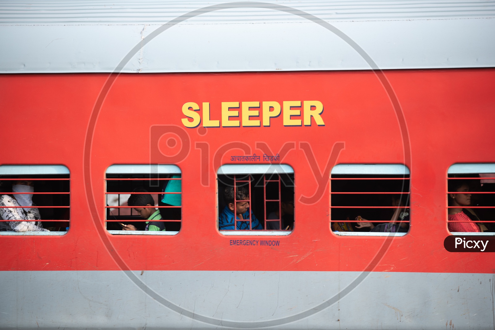 Passengers Of a train In a Sleeper Bogie  in an Indian Railways train