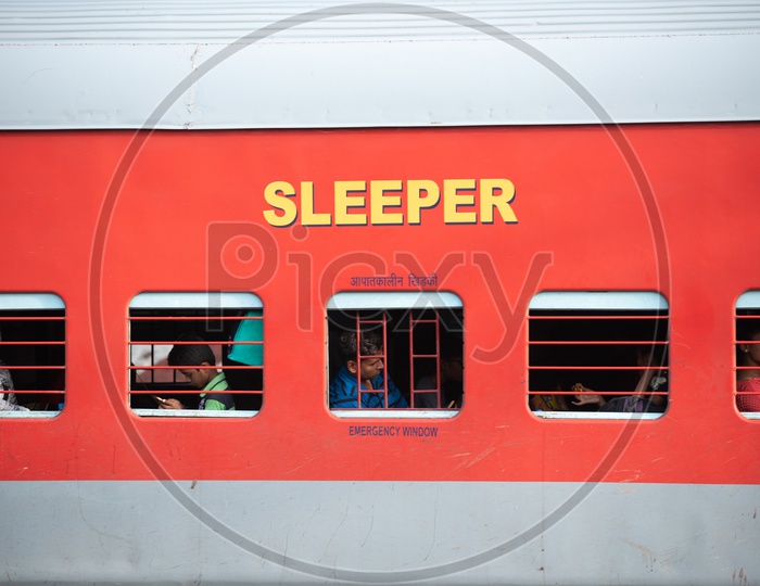 Passengers Of a train In a Sleeper Bogie  in an Indian Railways train
