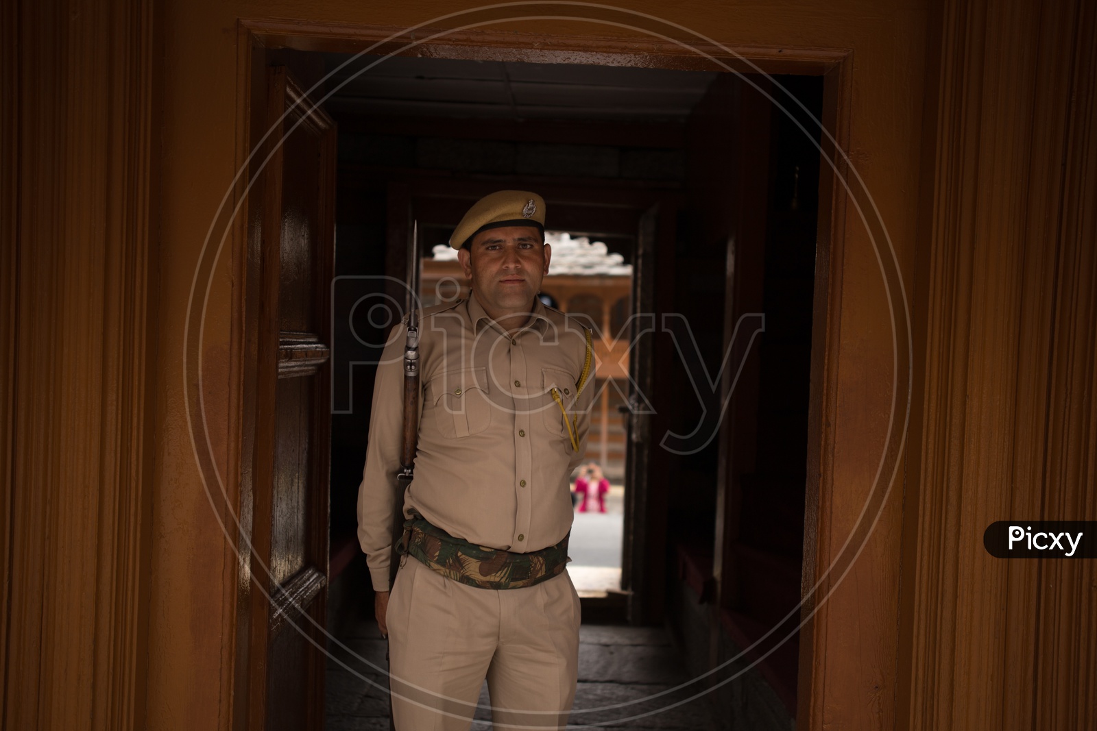 A Security Guard With a Gun In Duty At Goddess Mathi temple  In Spiti Valley