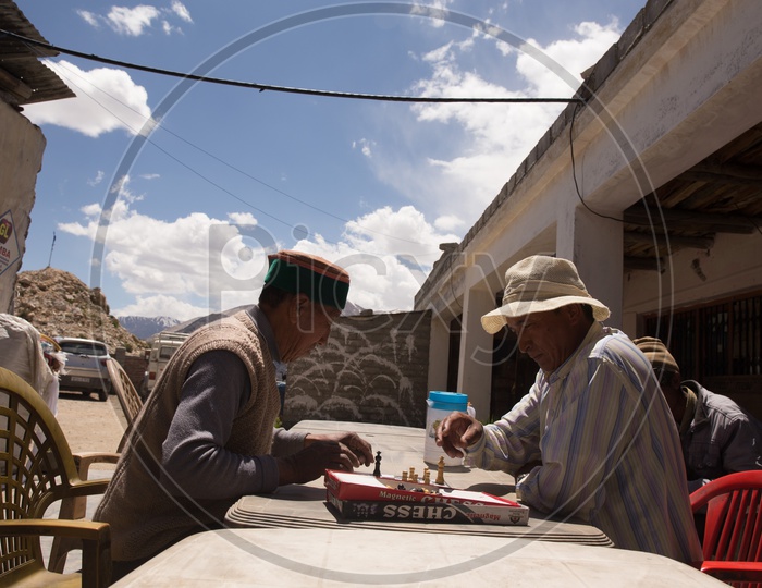 Villagers Playing Chess By Sitting At a Eatery Shop  In A Village At Spiti Valley