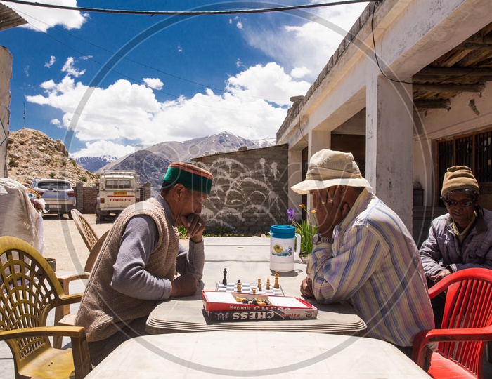 Villagers Playing Chess By Sitting At a Eatery Shop  In A Village At Spiti Valley
