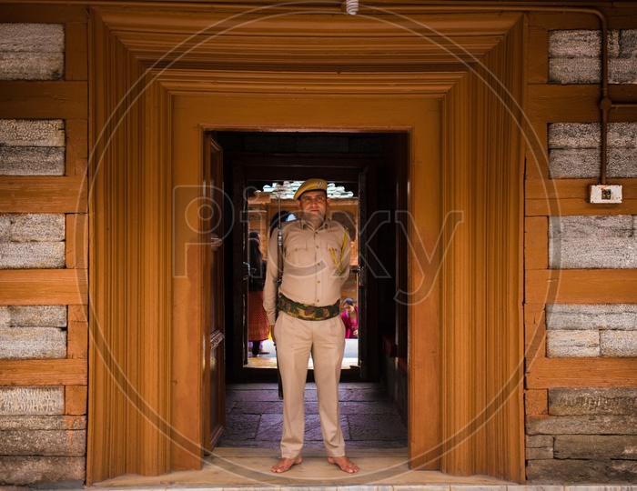 A Security Guard With a Gun In Duty At Goddess Mathi temple  In Spiti Valley