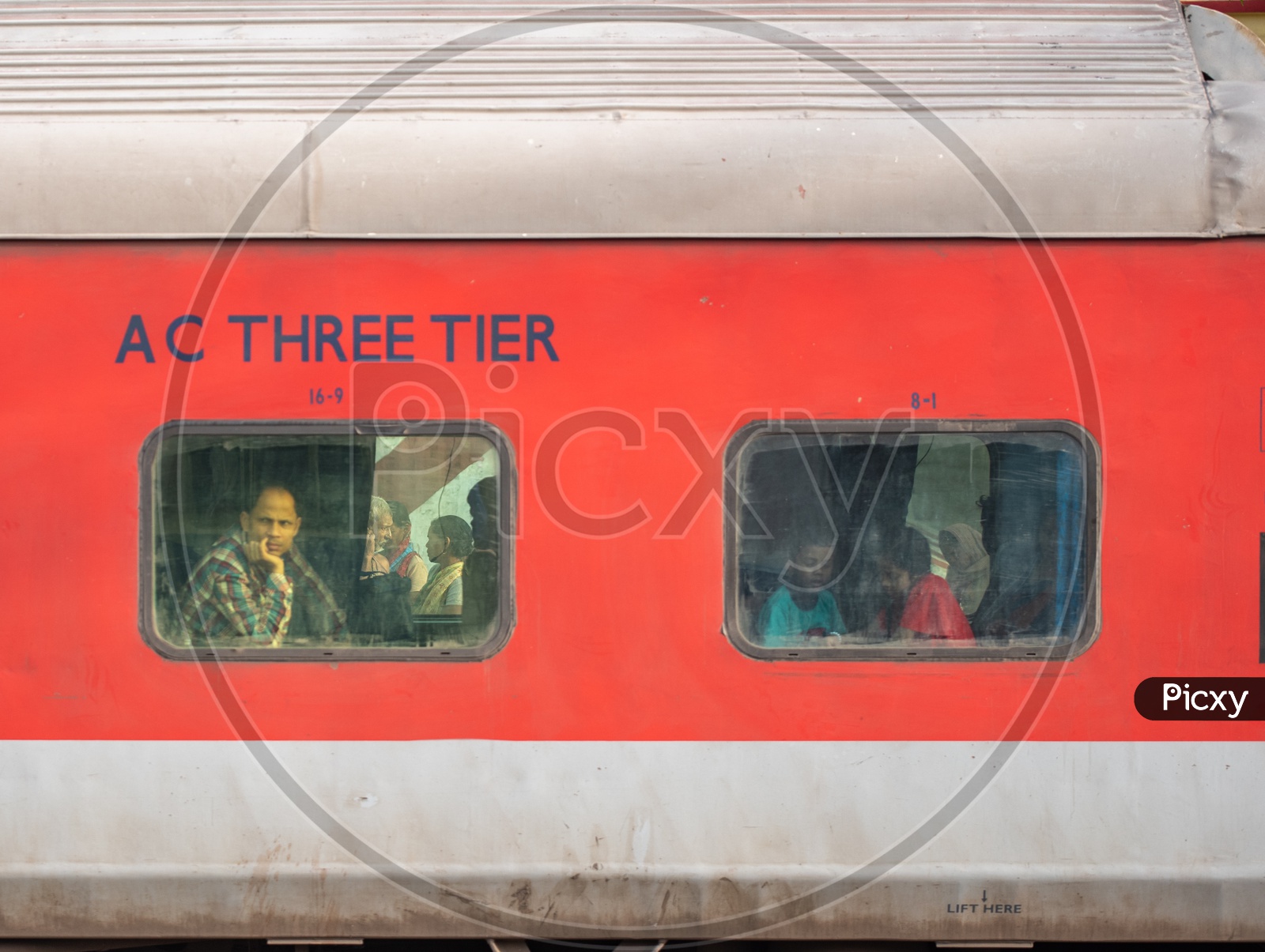 A Passenger Looking Through the Window Glass from  a AC Three tier  Bogie of Indian railways Train