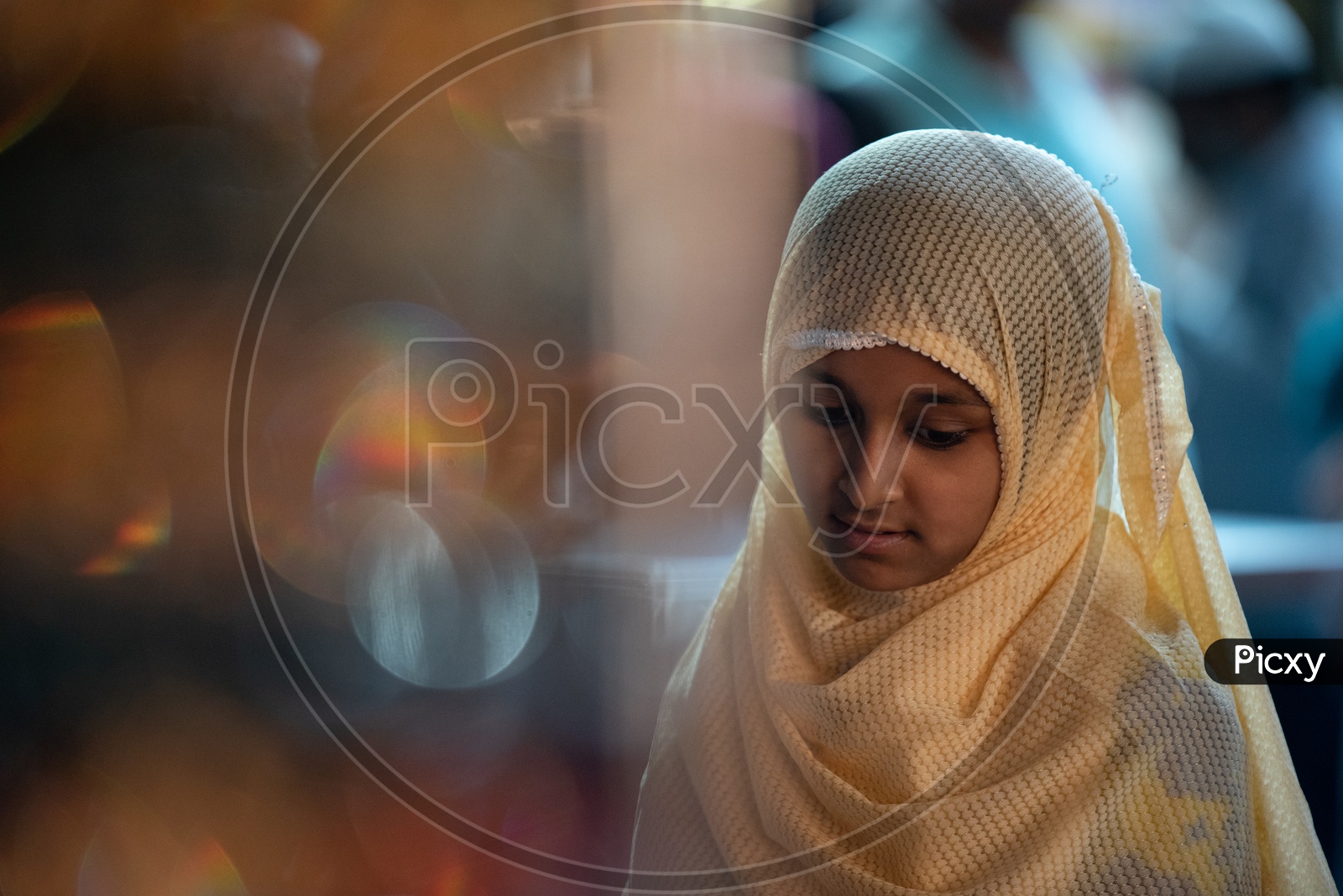 A Muslim Girl In Burkha  Shopping Imitation jewellery Or  Bangles or Ear Rings  At a Vendor Stall Around Charminar Streets  During Ramzan or ramadan Season