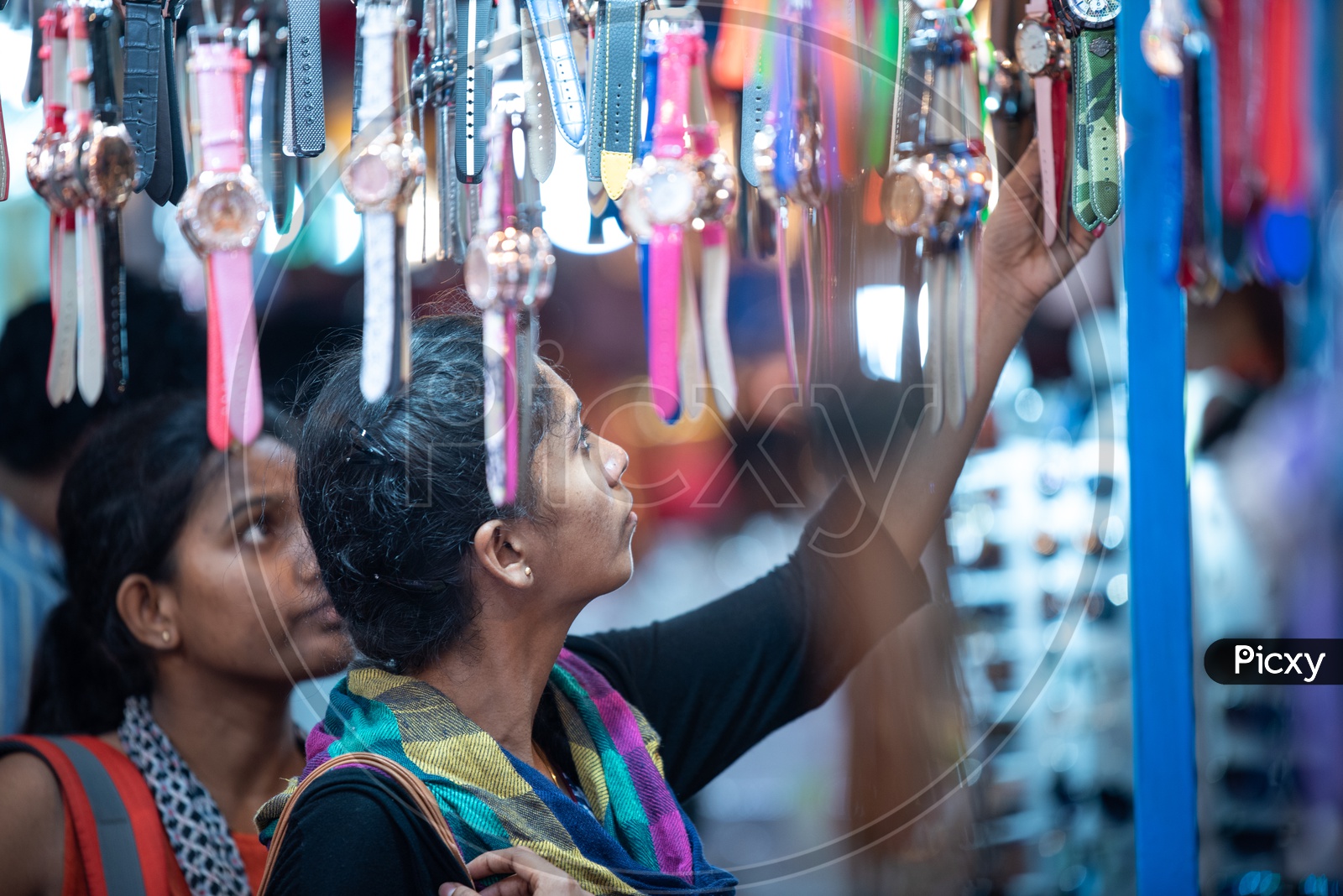 Young Girls   Shopping  Wrist Watches  In a Vendor Stall Around Charminar  During The Ramdan Or Ramzan Season