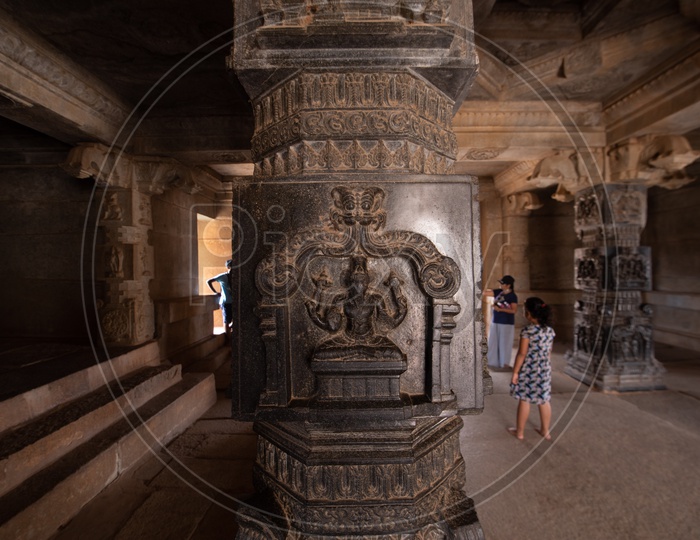 Architectural Views Of  Hampi Temple With  Pillars in a Temple And Designs On The  Pillar Closeup
