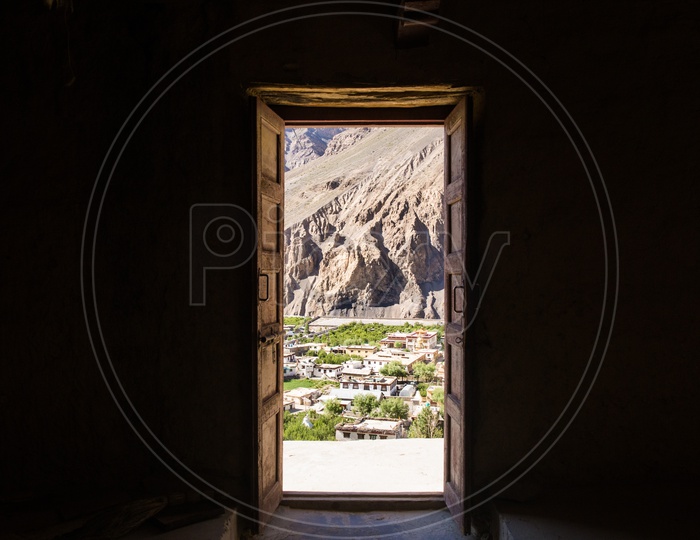 A View Of Tabo Village And Sedimentary Hills From The Door Openings of Tabo Monastery