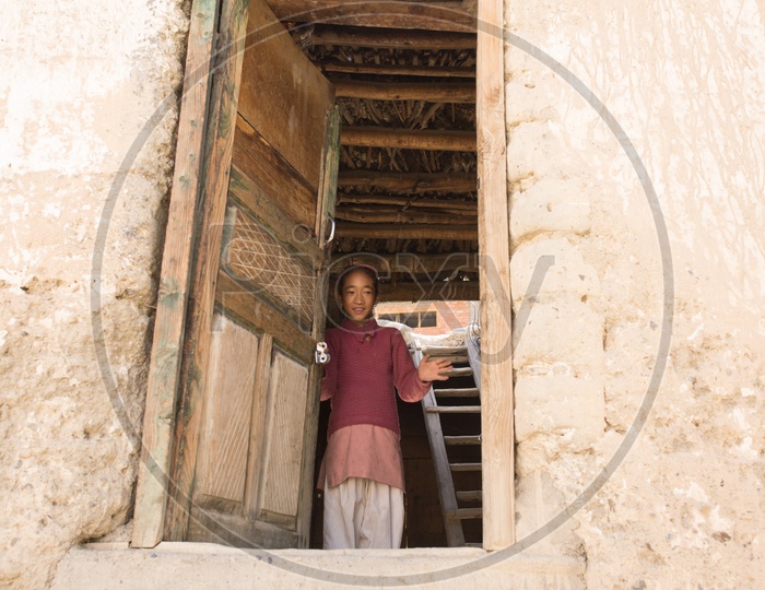 A Girl Child At a House Door Step  In Tabo Village