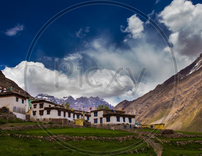 Houses On the Terrain Villages Of Spiti Valley With a Snow Capped Mountains In  The  Background
