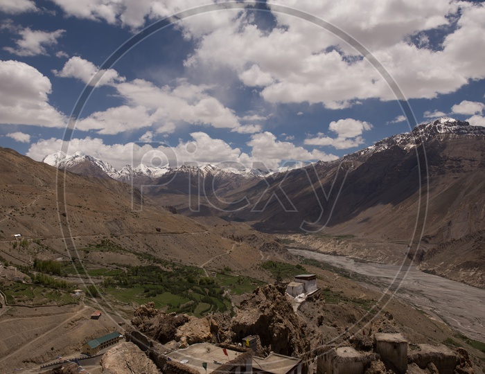 Landscape View Of Snow Capped Mountains And Sedimentary Hills From The Villages Of  Spiti Valley
