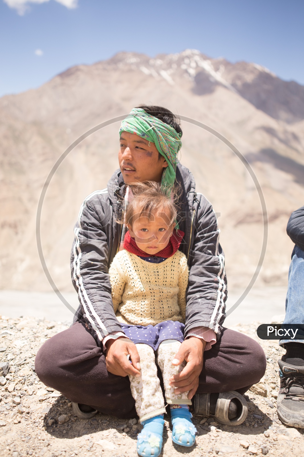 A Father with His Girl Child in Spiti Valley Ghat Roads