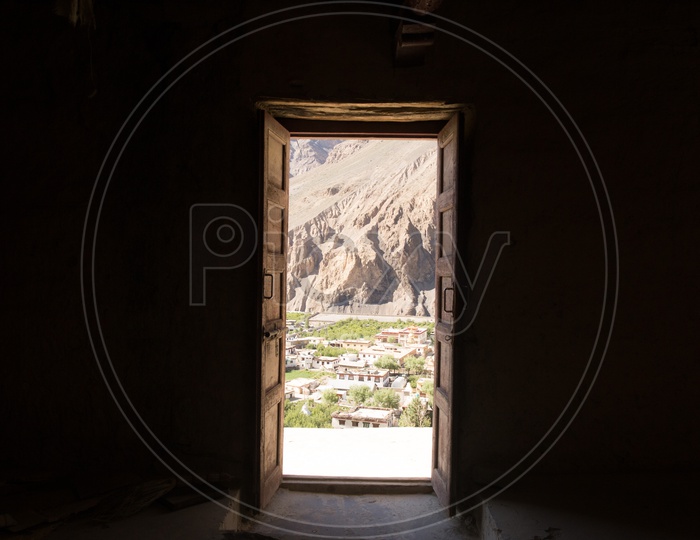 A View Of Tabo Village And Sedimentary Hills From The Door Openings of Tabo Monastery