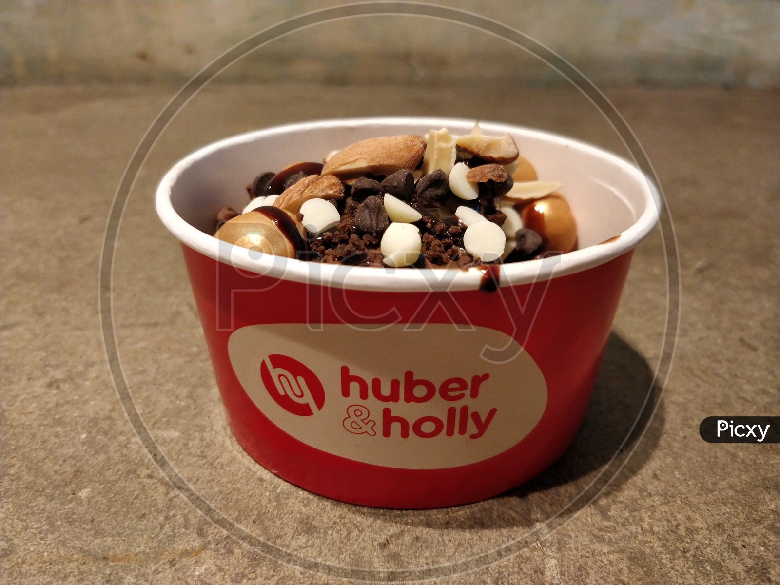 Huber and Holly logo on a ice creams cup
