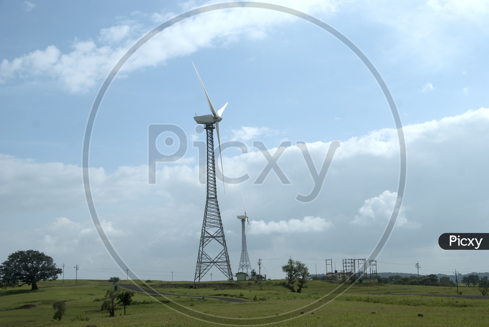 Wind Mill On a Green Terrain High Land