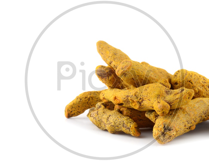 Dry Turmeric roots or barks isolated on white background