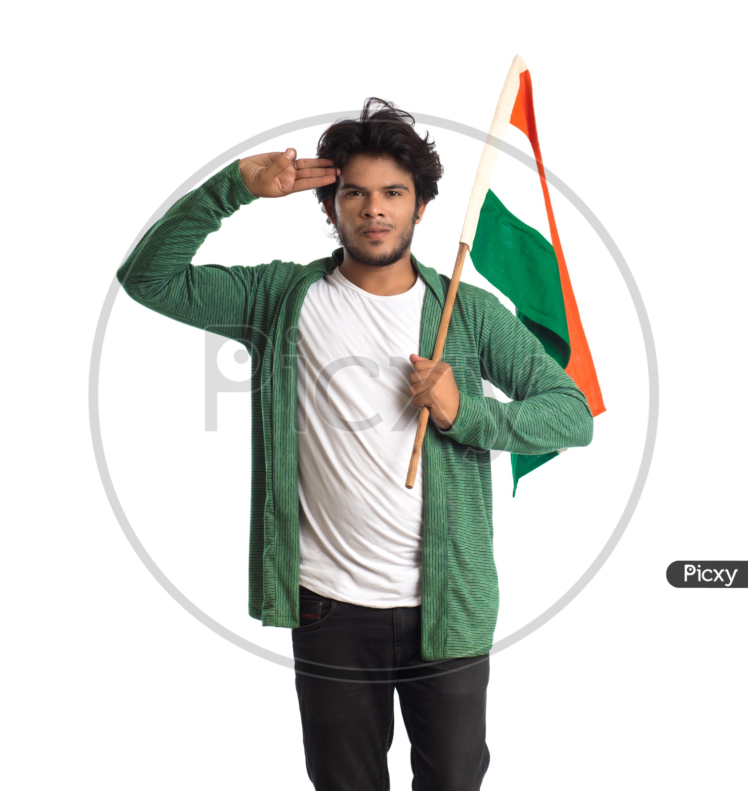 A Young Indian man Holding  Indian National Flag ( Tri Color )  In Hands And With a  Saluting Pose  Over a White Isolated Background