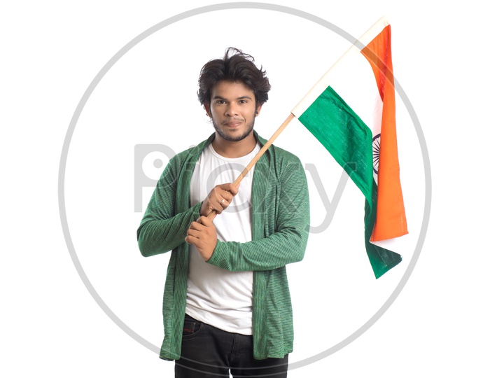 A Young Indian man Holding and Waving   Indian National Flag ( Tri Color )  Over a White Isolated Background