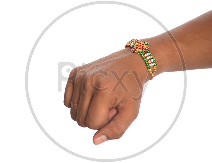 Indian Young Man Hand Tied With Elegant Rakhis  On an Isolated White Background