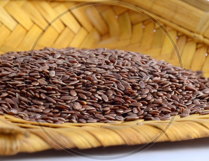 Flax seeds in winnowing basket