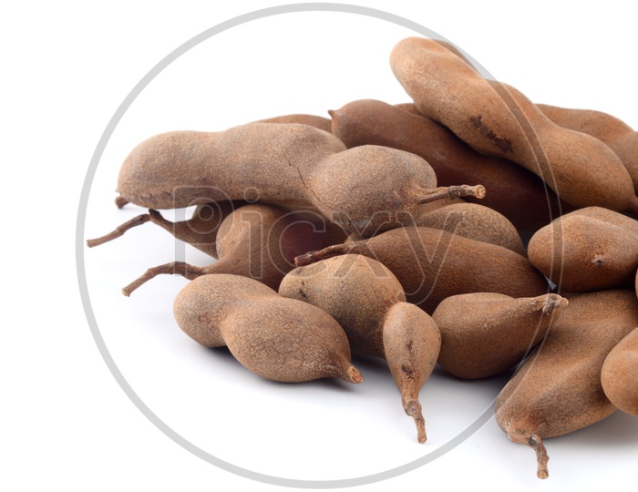 Tamarind Or Sweet Tamarind Fruit on an Isolated White Background