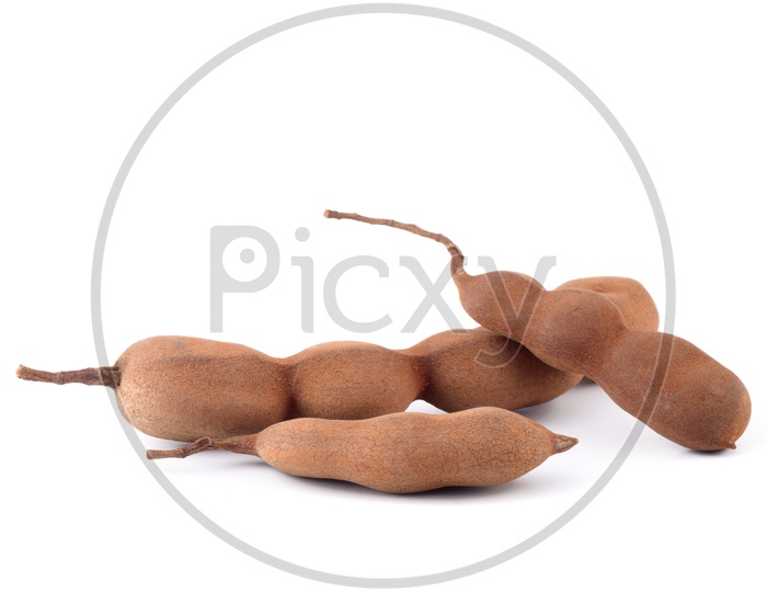 Tamarind Or Sweet Tamarind Fruit on an Isolated White Background