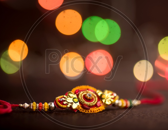 An Elegant Rakhi With an Led Bokeh Background