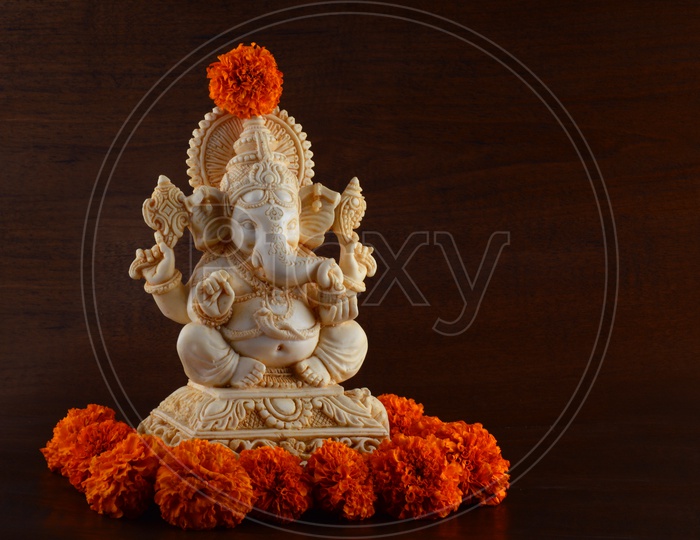 Lord Ganesha Idols decorated with MariGold flowers