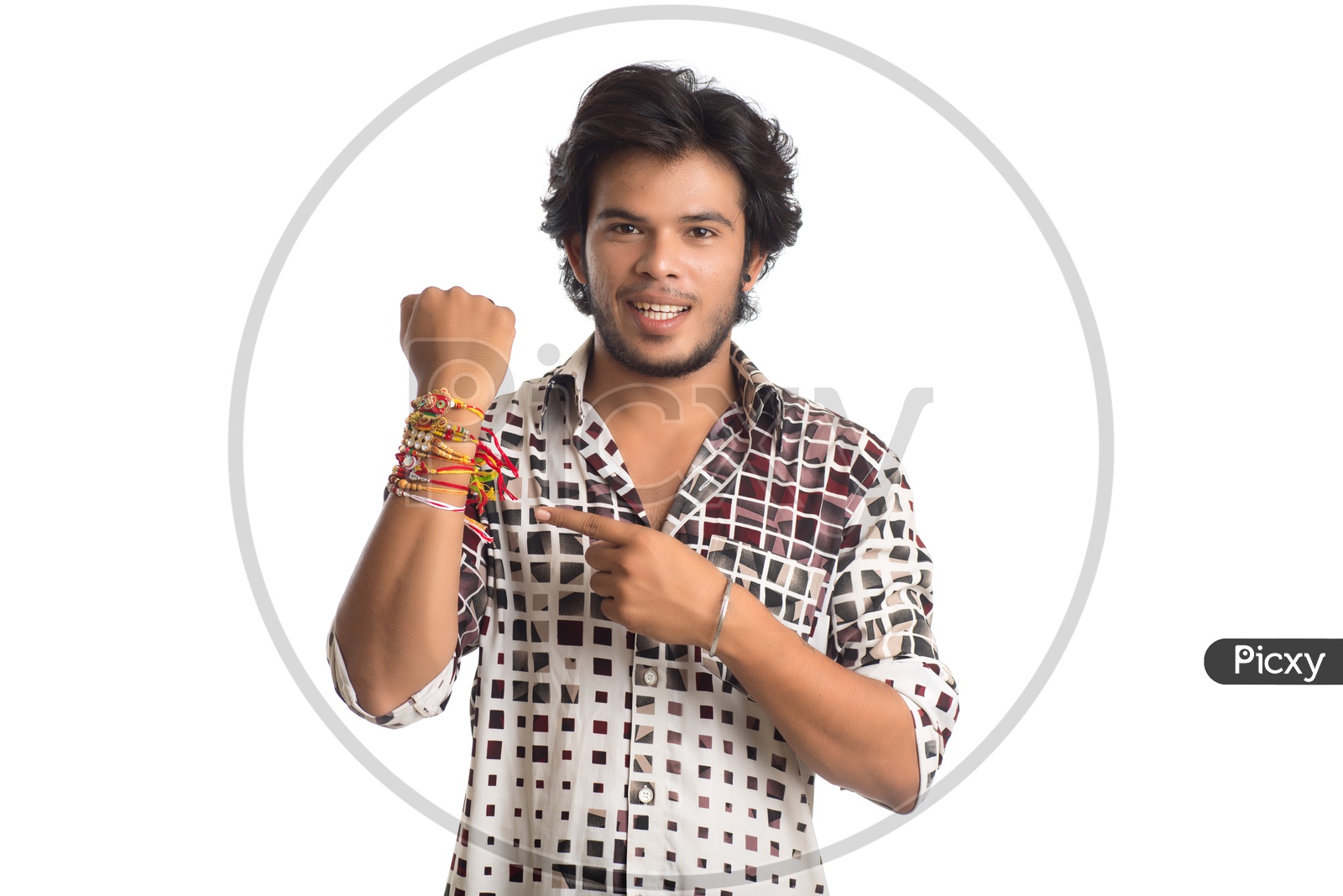 Indian Young Man Showing Rakhi Tied Hand And Smiling On an  Isolated White Background