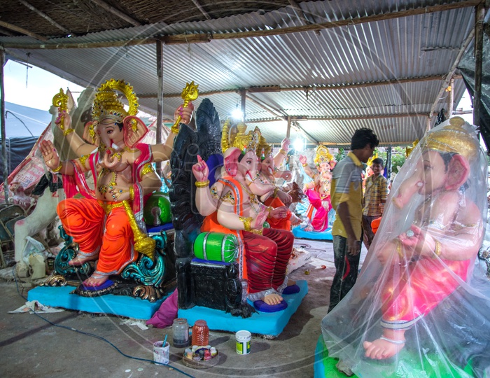 Indian Artisans alongside the Lord Ganesha Idols