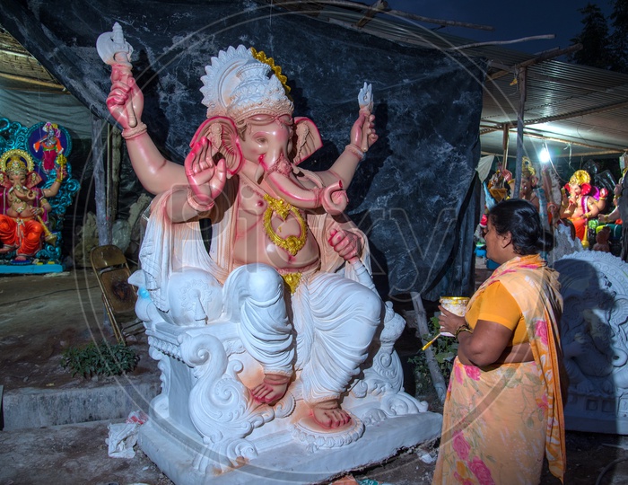 Indian Artisan painting the Ganesha Idol