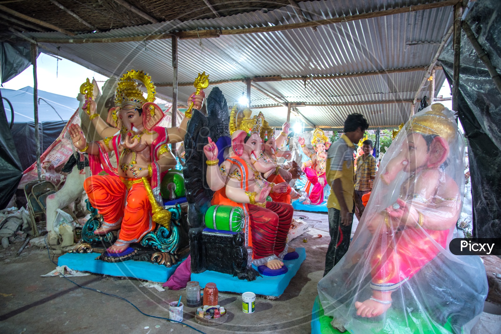 Indian Artisans alongside the Lord Ganesha Idols