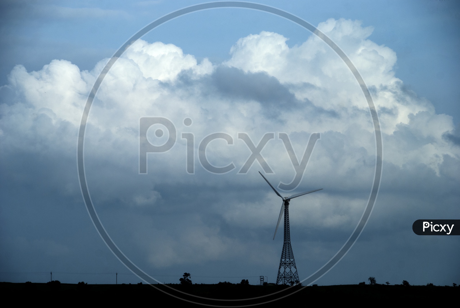 Wind mills , With a Blue Sky and Cotton Clouds In Background