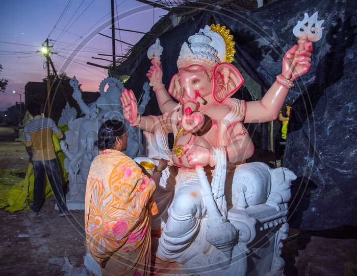 Indian Artisan painting the Ganesha Idol