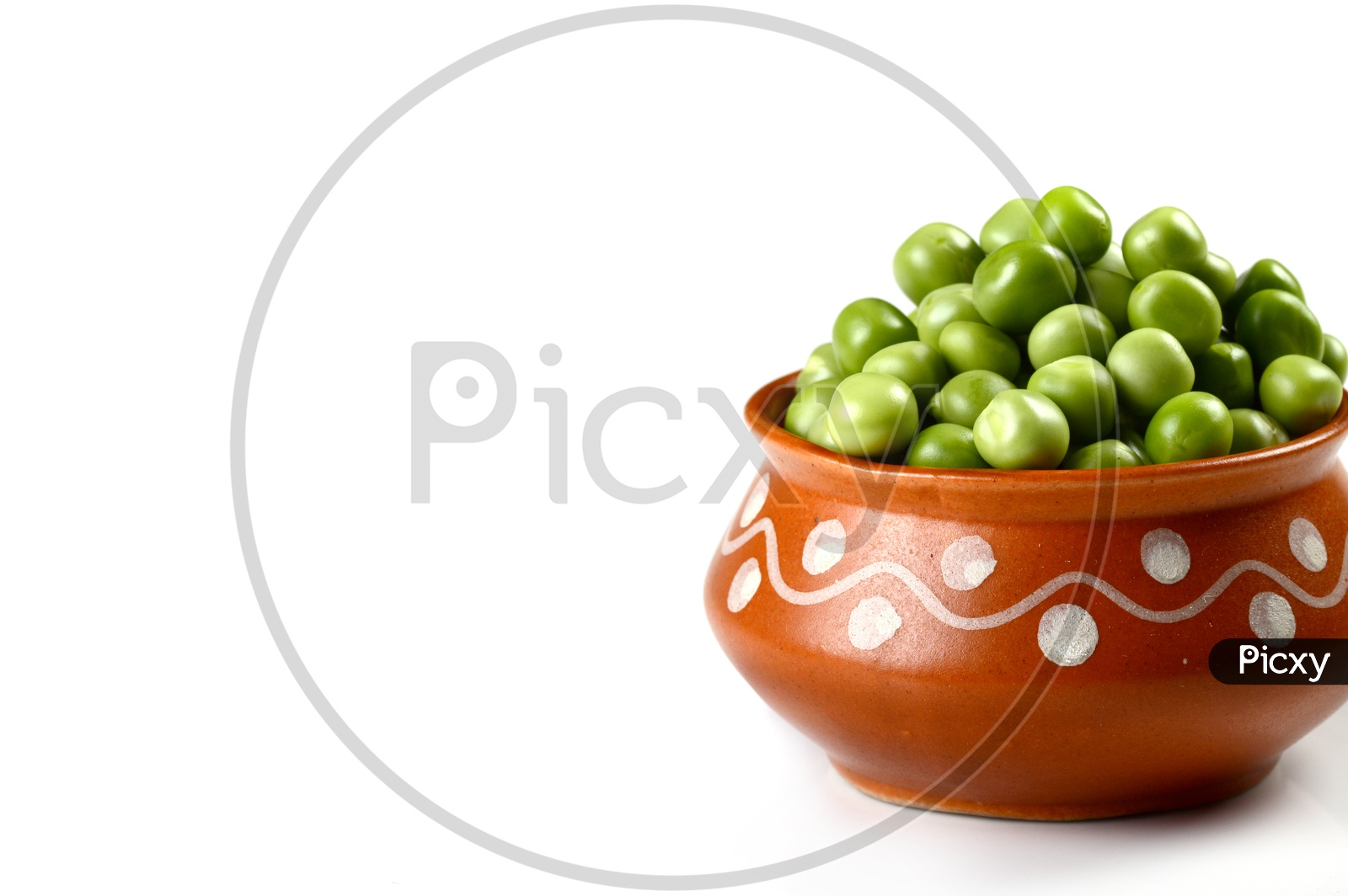 Fresh Green Peas in clay pot on An Isolated white background